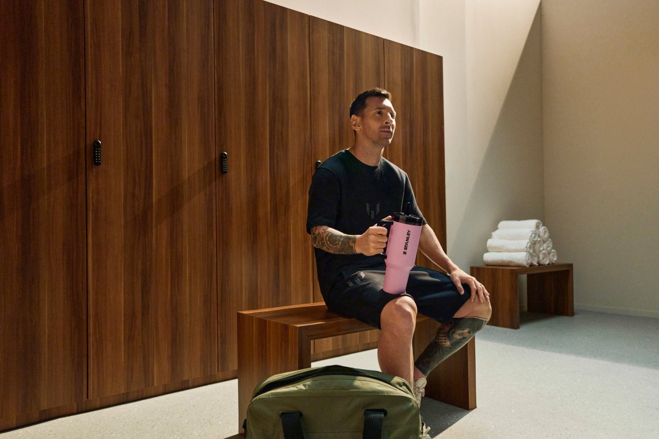 Leo Messi holding a Stanley bottle from the GOAT collection